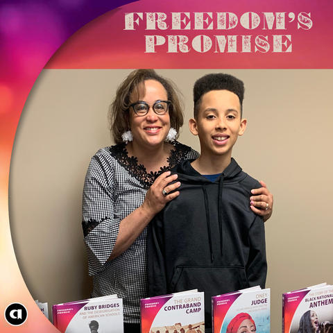 Photo of Duchess Harris and her son with a display of Duchess&#039; books